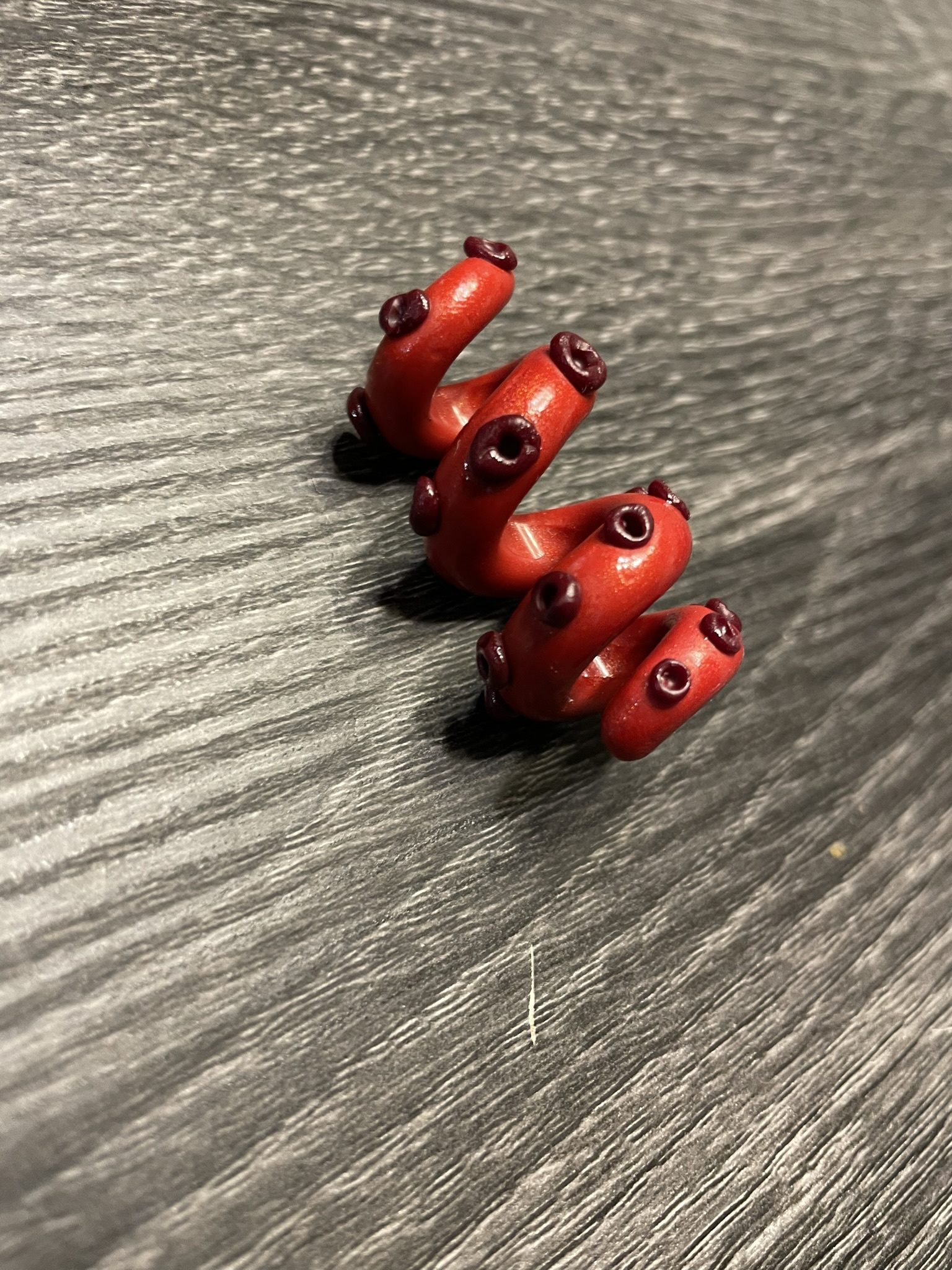Red spiral polymer clay bead