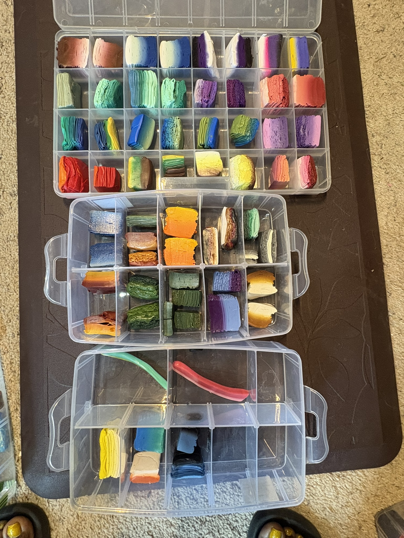 Clay blends stored in stacked boxes on the bench