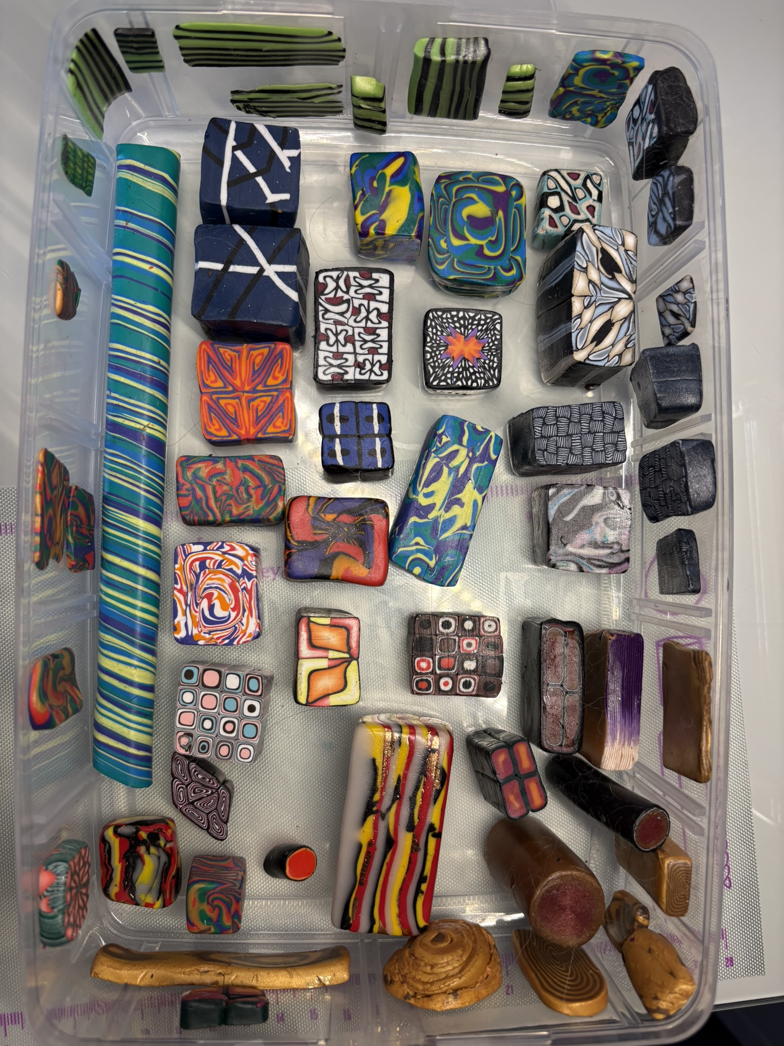 Box of patterned polymer clay canes